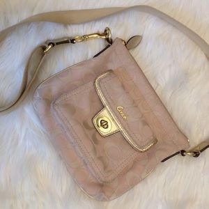 pretty coach soft pink with gold mini crossbody